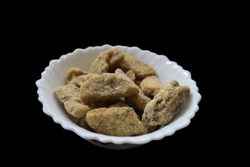 Sharkara chips madeup of Jaggery coating, Jaggery Coated Banana Chips sharkara varatti upperi with black background