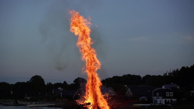 Bonfire. Holiday of Sankt Hans. Burning an effigy of a witch.