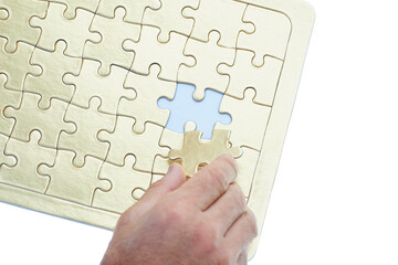 Person, hands and puzzle with piece for problem solving, solution or building on a white studio...