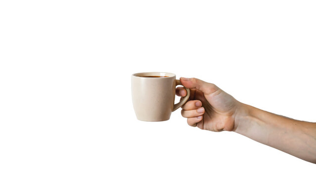 Hand holding a steaming cup of coffee