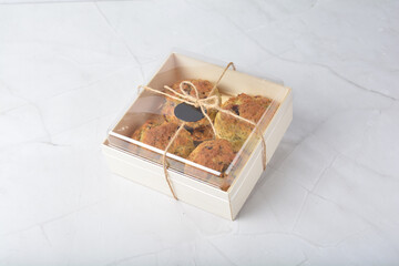 gourmet freshly bake golden Texas pope earl grey tea honey biscuit bun cake scone milk butter bread in square bento wood box on white marble table rose gold fork knife pastry halal dessert vegan menu