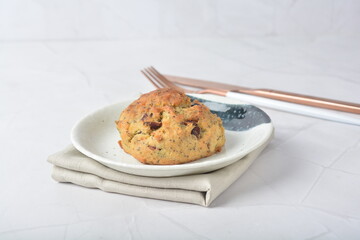 gourmet freshly bake golden Texas pope earl grey tea honey biscuit bun cake scone milk butter bread in square bento wood box on white marble table rose gold fork knife pastry halal dessert vegan menu