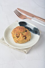 gourmet freshly bake golden Texas pope earl grey tea honey biscuit bun cake scone milk butter bread in square bento wood box on white marble table rose gold fork knife pastry halal dessert vegan menu