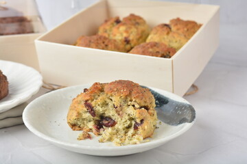 gourmet freshly bake golden Texas pope earl grey tea honey biscuit bun cake scone milk butter bread in square bento wood box on white marble table rose gold fork knife pastry halal dessert vegan menu