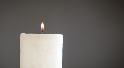 White burning decorative beautiful candle.