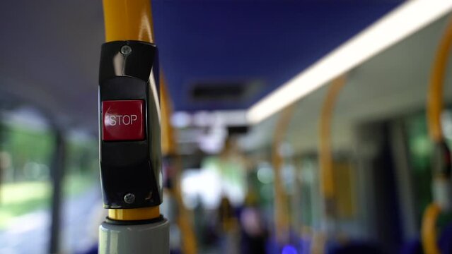 Stop button on the bus. Public transport.
