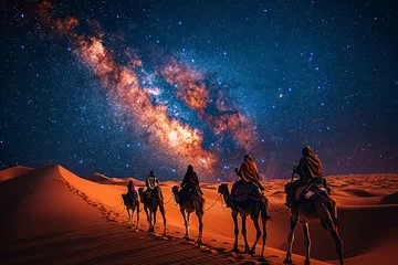 Fotobehang people riding camels in the desert, camel in the desert, sunset over the desert © fadi