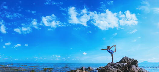 Asian women relax in the holiday. Travel relax.  Play if yoga. On the rocks by the sea. In the summer. Thailand - 759531854