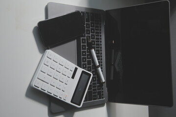 Office leather desk table with calculator and pen. Top view with copy space