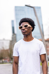 Modern african young man in sunglasses and casual clothes