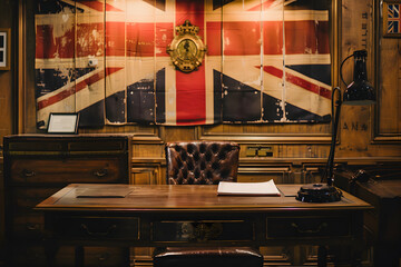 a table and chair in an office setting, with the British flag displayed prominently on the back wall, infusing the space with regal charm and cultural significance - obrazy, fototapety, plakaty