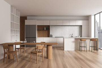 Beige home kitchen interior with eating and cooking space, panoramic window