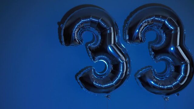 Party Happy Birthday Thirty-Three with Silver Grey number . Gel balls 33 for congratulations celebrations holiday. Close-up, neon lighting, no people