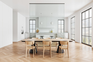 Luxury home kitchen interior with eating table, glass partition and bar counter