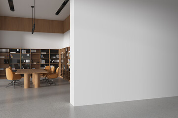 Plakaty  Modern office meeting room interior with table and chairs, shelf and mockup wall
