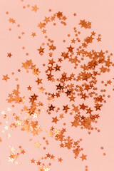 golden confetti on pink background, greeting card template