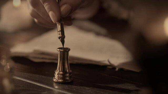 Antique female writing with old feather pen. Woman in renaissance dress writing a love letter with vintage quill pen on old parchment papers sheet.