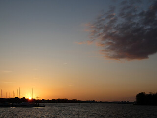 Naklejka premium Beautiful sunset in the city harbor of Rostock (Germany)