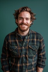 Handsome smiling, happy and pleased stoic man with positive vibes. Portrait of a joyful young man with beautiful hair and fashionable clothes.