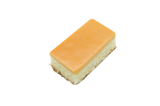 
A slice of cake with a yellow frosting. The cake is cut into a square shape. The frosting is thick and creamy
2