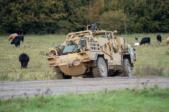 British army Supacat Jackal 4x4 rapid assault, fire support and reconnaissance vehicle, in action on a military exercise, Wilts UK