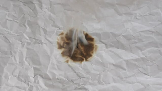 burning paper from center hole fire.