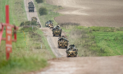 a convoy of British army Supacat Jackal 4x4 rapid assault, fire support and reconnaissance vehicle...