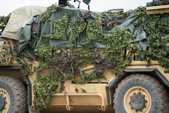 British army Supacat Jackal 4x4 rapid assault, fire support and reconnaissance vehicle with camouflage, in action on a military exercise, Wilts UK