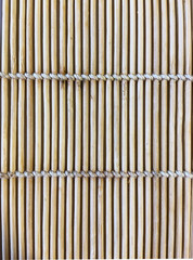 light beige bamboo mat with white threads