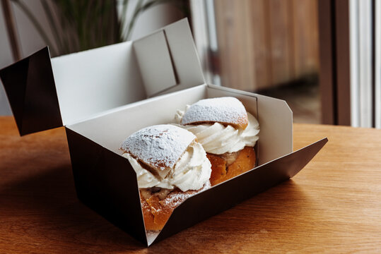 semla, is a traditional sweet roll made in various forms in Sweden. semla in paper box