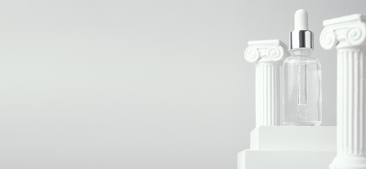 Cosmetic bottle on podium and roman column on grey background. Horizontal long banner for web...
