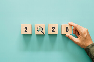 2025 Growth and success with graph inside magnifying glass icon. Concept of growth and success or rising successful development and business development in the future