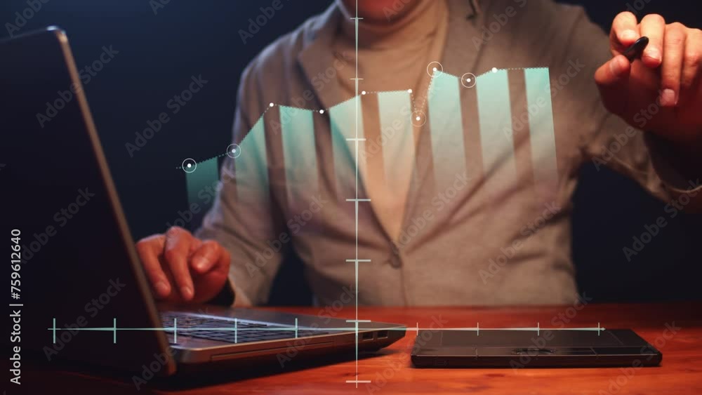 Poster a man working on a computer draws moving graphs and diagrams with digital indicators with a light pe