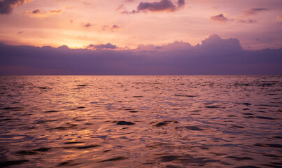 Purple sunset sky on ocean, Scenic sea sunset over calm water surface - 759615614
