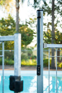 Self closing pool gate with child proof latch to open
