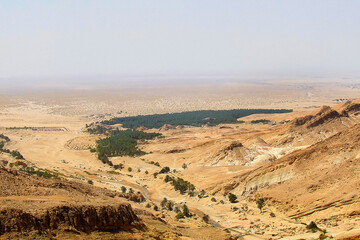 desert landscape; oasis; mountain valley top view; rivulet; Sahara desert; Africa