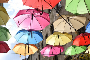 The dеcor is made of multi-coloured umbrellas.