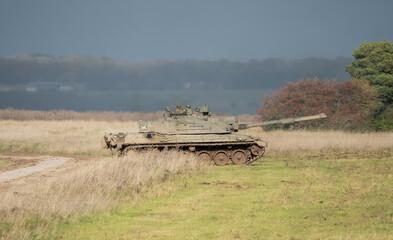 Commander and gunner directing a British army Challenger 2 II FV4034 main battle tank in action on...