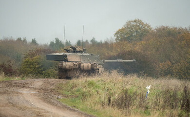 British army Challenger 2 II FV4034 main battle tank in action on a military exercise, taking aim