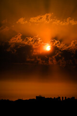 Fototapeta premium the sun rising through the clouds