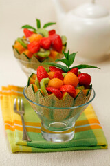 Stuffed melon with cheese and fruit.