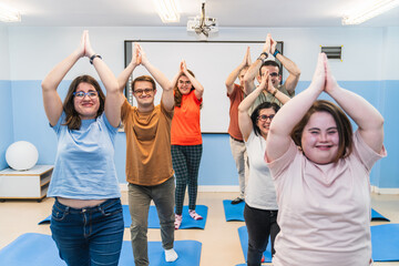 Yoga students with Down Syndrome unite for a harmonious group pose, sharing joy.