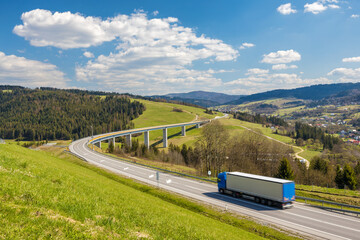 Truck on the highway through the mountainous country in the northwest of Slovakia near the Polish...