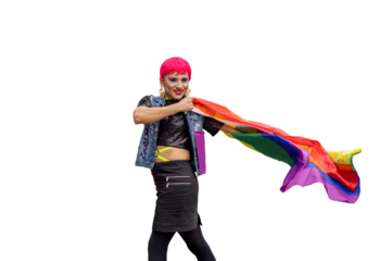 A transgender person with pink hair and a rainbow flag in his hand