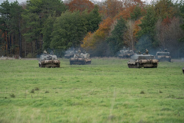 a squadron of British army FV4034 Challenger 2 ii main battle tanks moving out on a military combat...