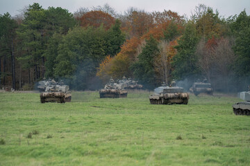 a squadron of British army FV4034 Challenger 2 ii main battle tanks moving out on a military combat...