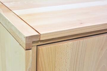 Wooden dresser surface. Natural wood furniture close view