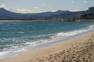 Sand beach of South France during spring with sea waves