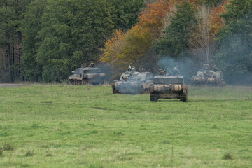 a squadron of British army FV4034 Challenger 2 ii main battle tanks moving out on a military combat...