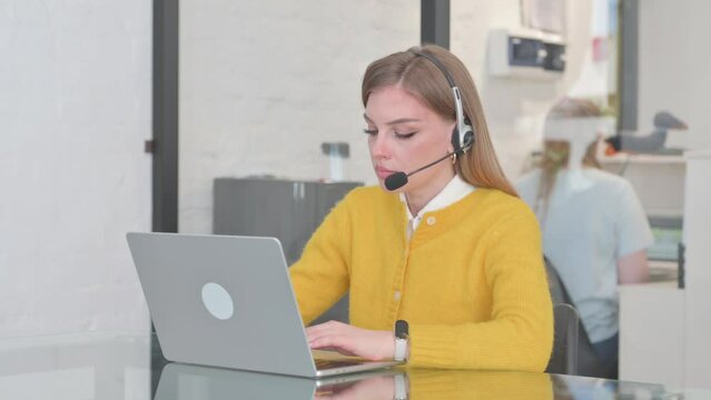 Woman with Headset Working in Call Center